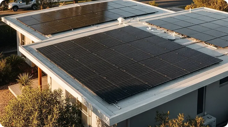 Residential solar setup rooftop panels generating clean energy, indoor inverters converting it for home use