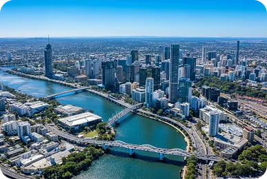 Aerial view of Brisbane city skyline and Brisbane River, Queensland, showcasing CBD skyscrapers, bridges, and urban landscape.